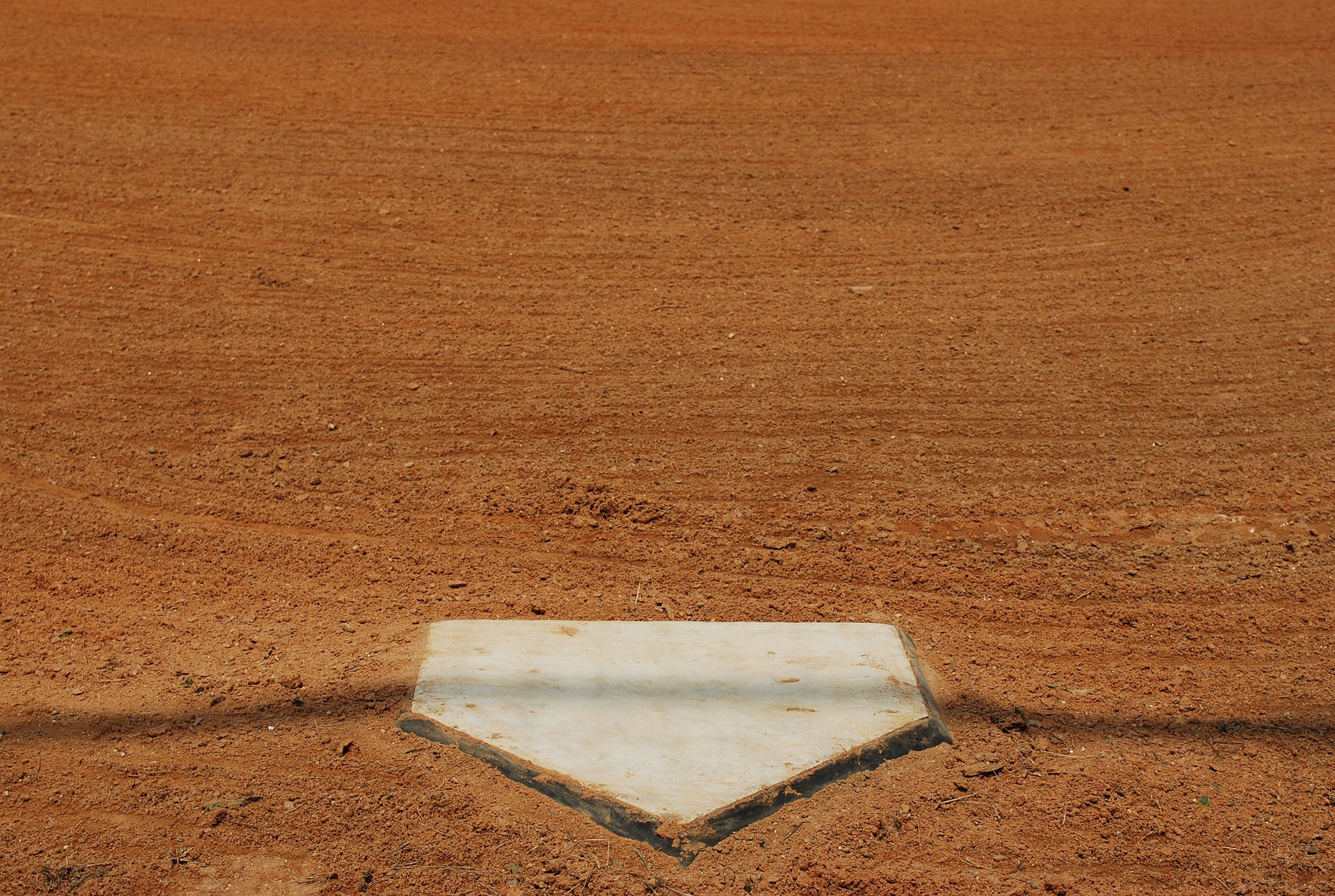 A wide shot of home plate at a baseball field